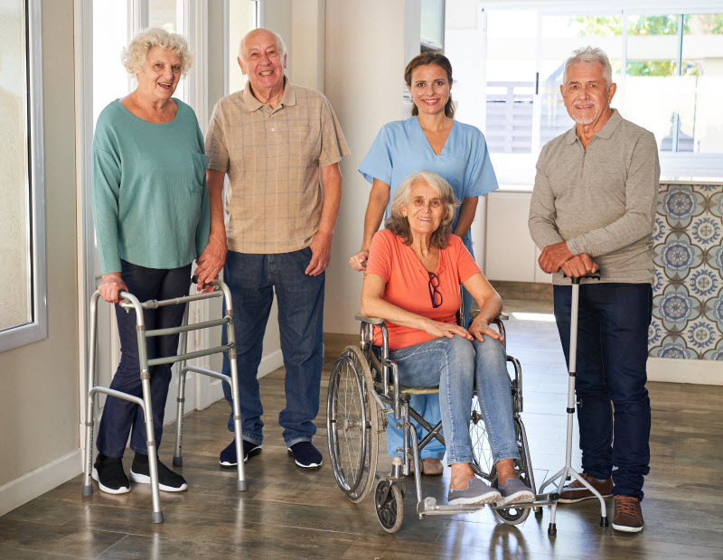 Group of seniors and nurse together in the rehabilitation clinic